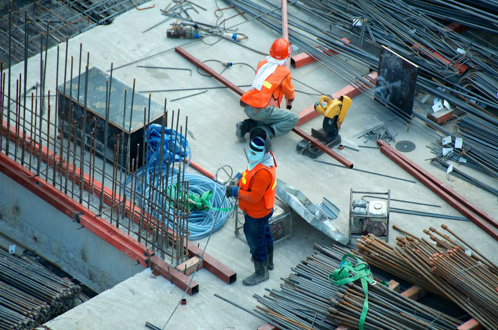 People wearing hard hats reviewing work on a construction site.
