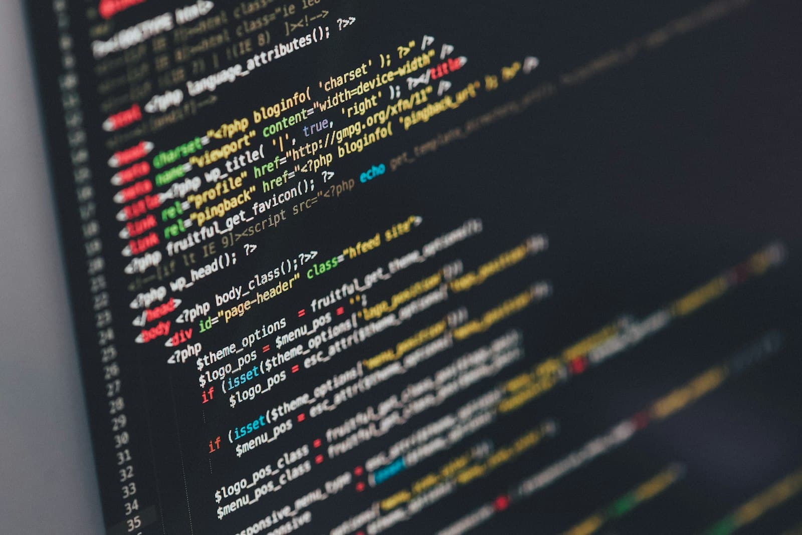 A close view of a monitor filled with software code.